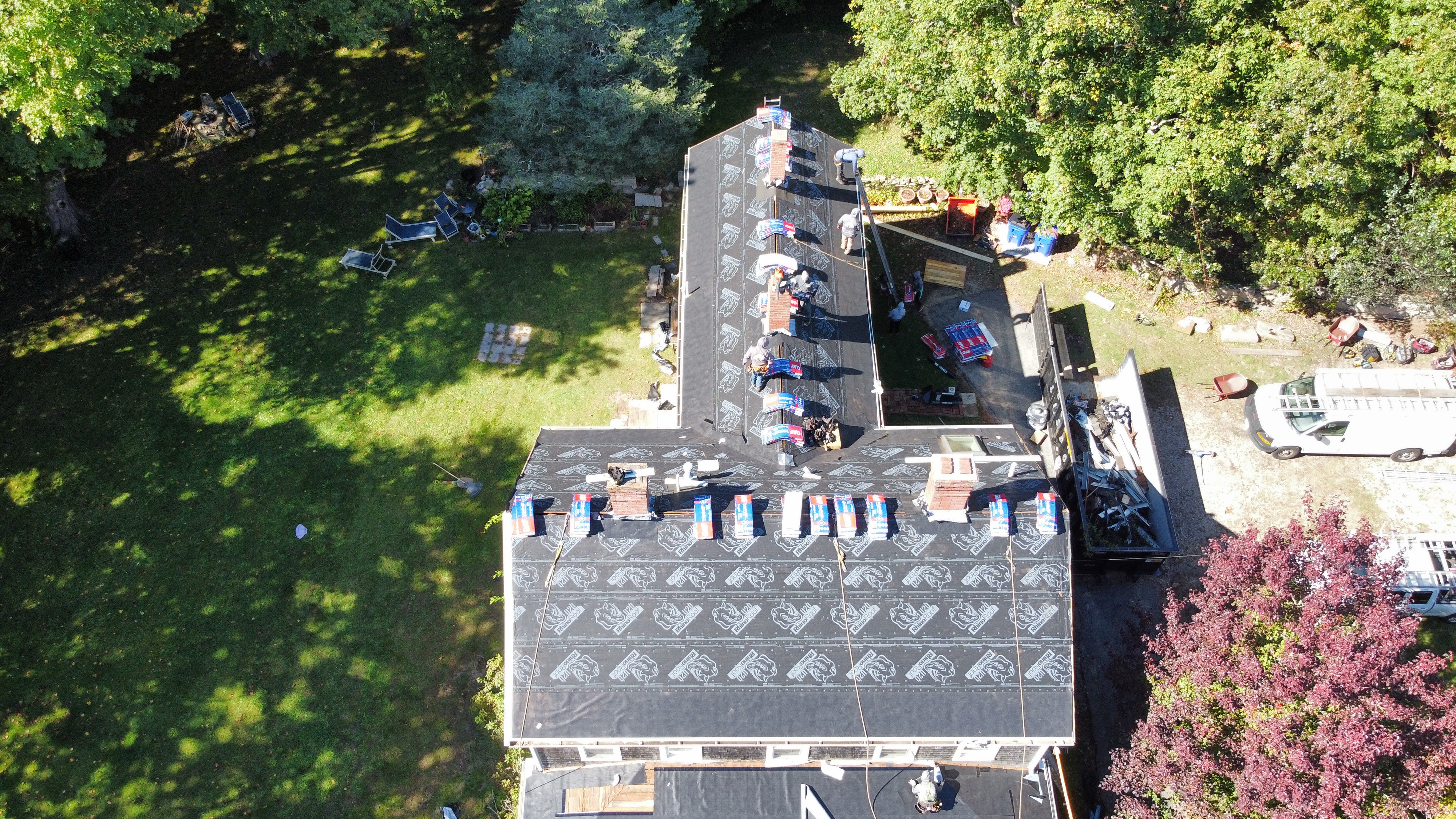 Underlayment being installed on roof