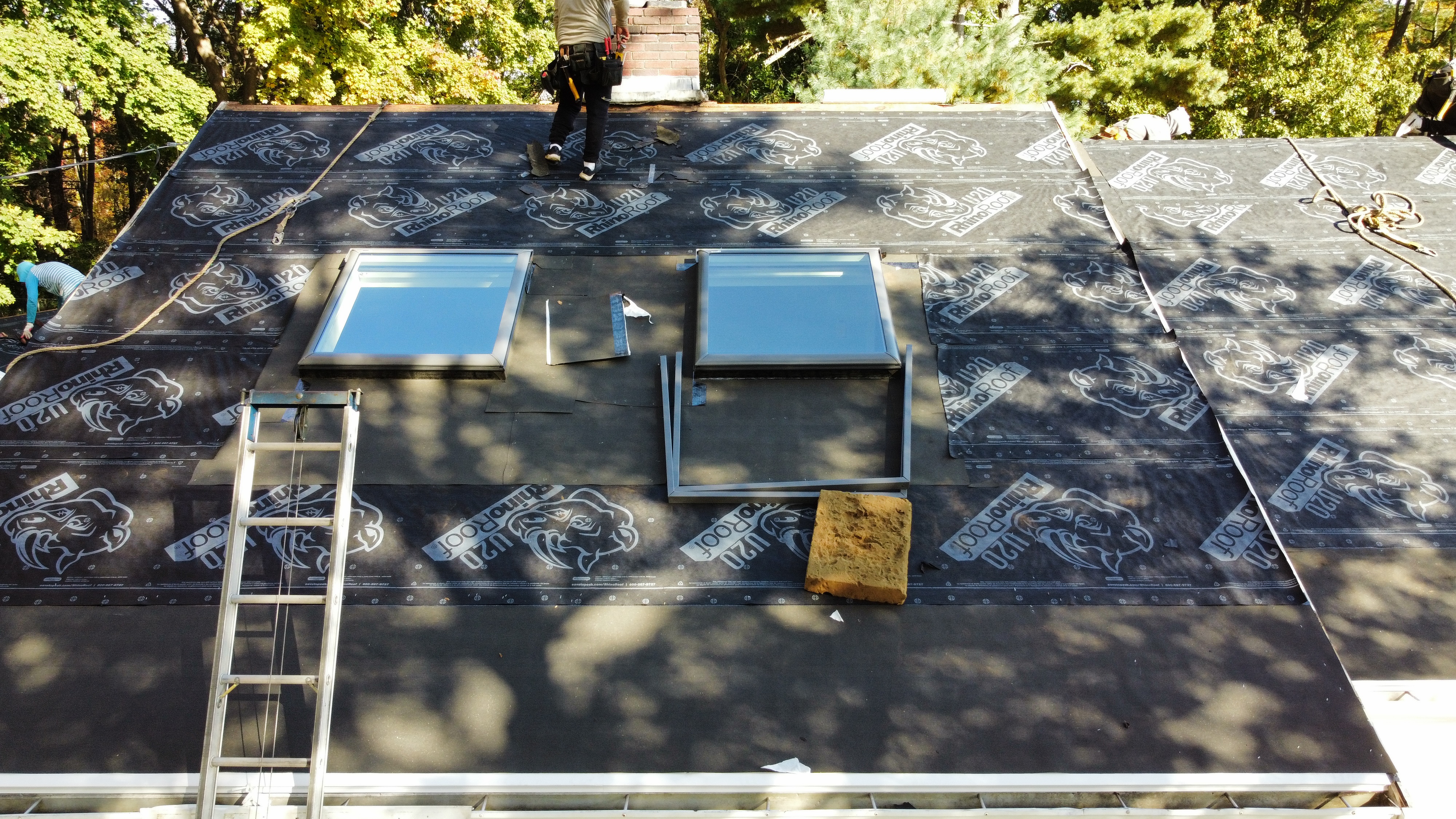 Skylights being set in underlayment