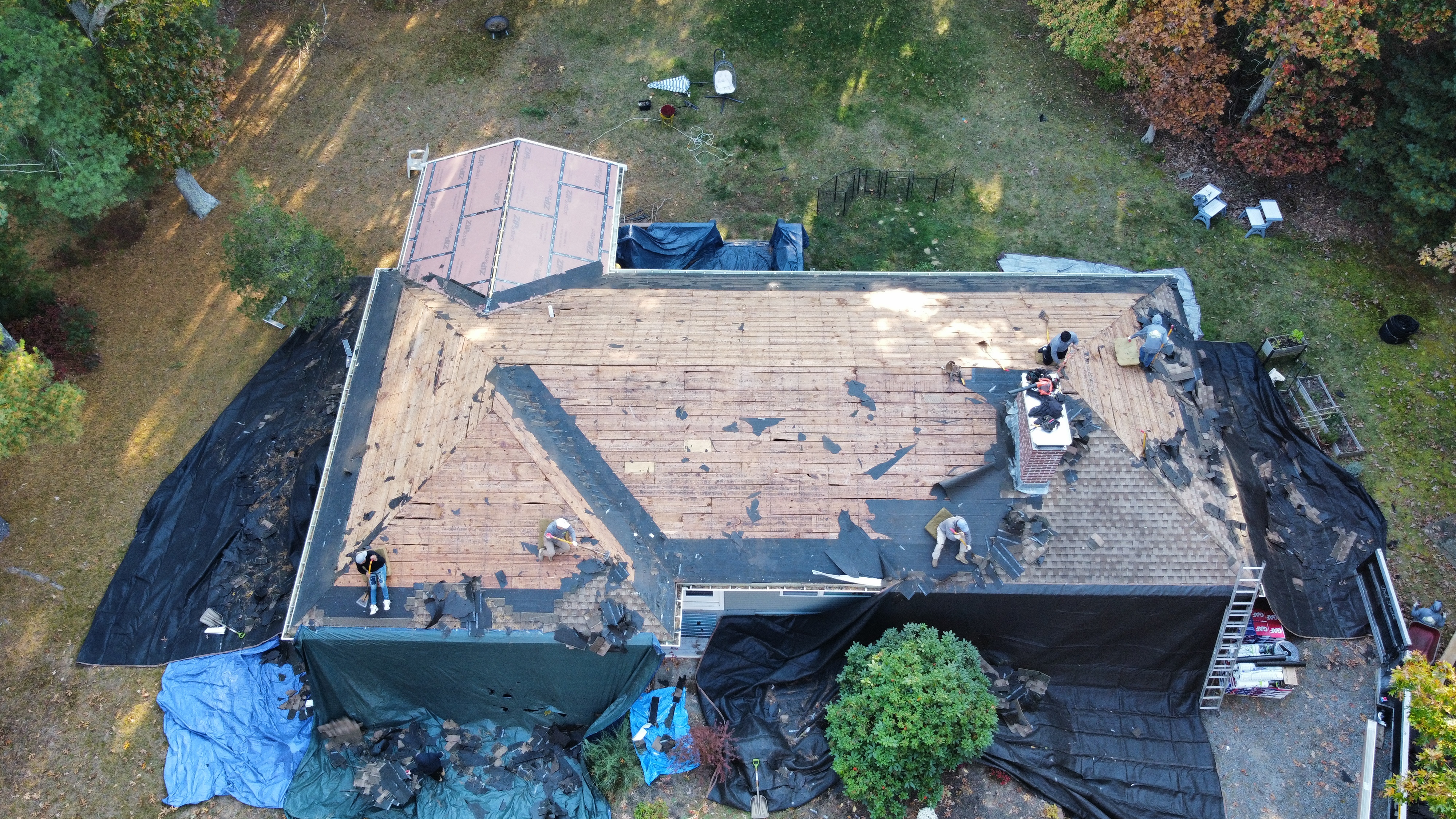 Crew working on roof mid-morning
